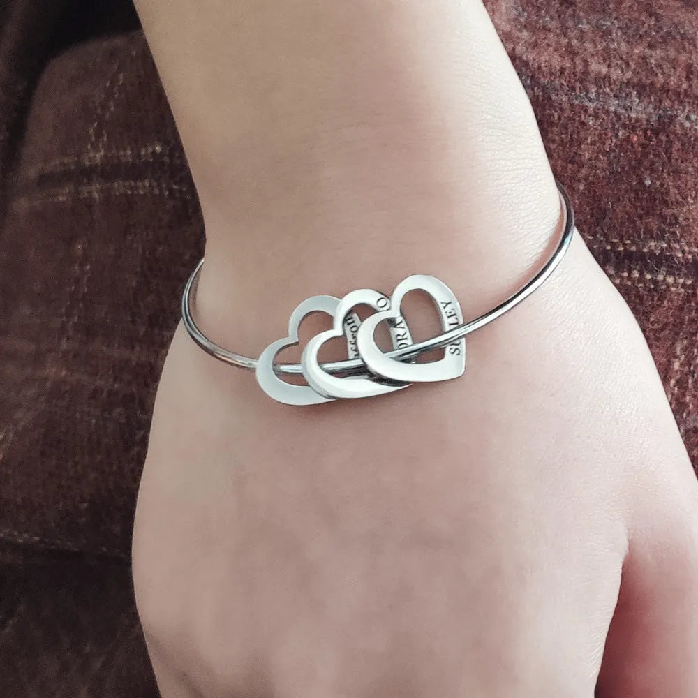 Love bracelet with peach heart charm and name lettering in stainless steel, silver colour