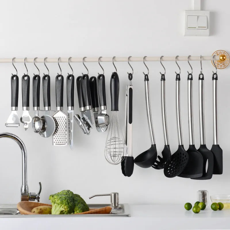 Black silicone cooking spatula and spoon set with stainless steel handles containing 16 kitchen utensils