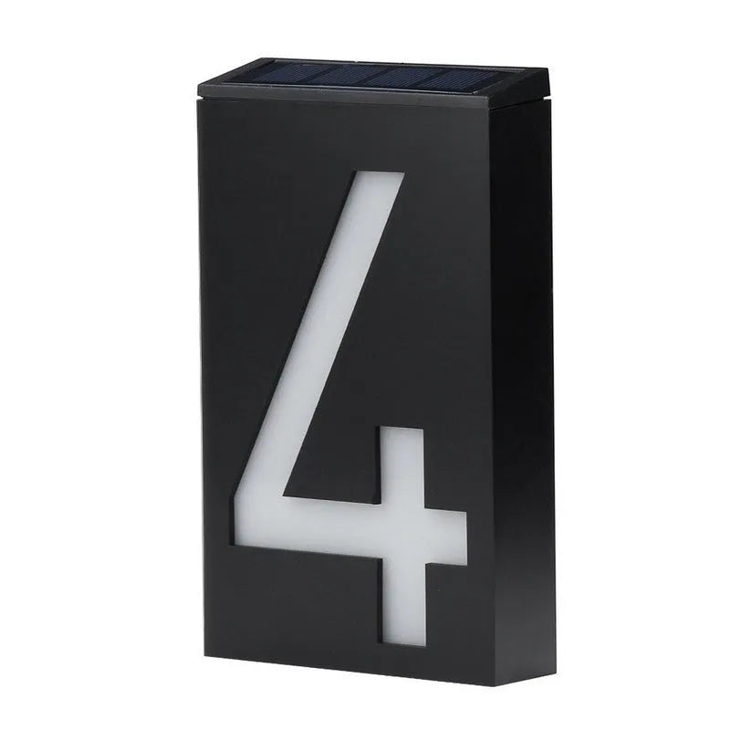Solar powered white LED house number light mounted on a wall with IP65 waterproof rating