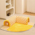Fan-shaped plush pet bed with integrated tunnel for cats and small dogs in a plaid pattern.