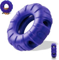 Blue natural rubber tyre-shaped dog chew toy with treat openings for slow feeding