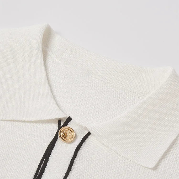 White women's cardigan with dark contrast lapels and short sleeves laid flat