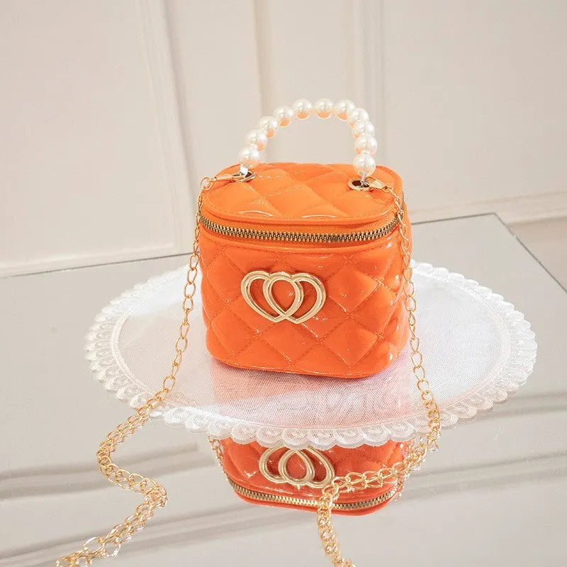 White PVC bucket-shaped gel bag with a heart pattern visible inside the open top.
