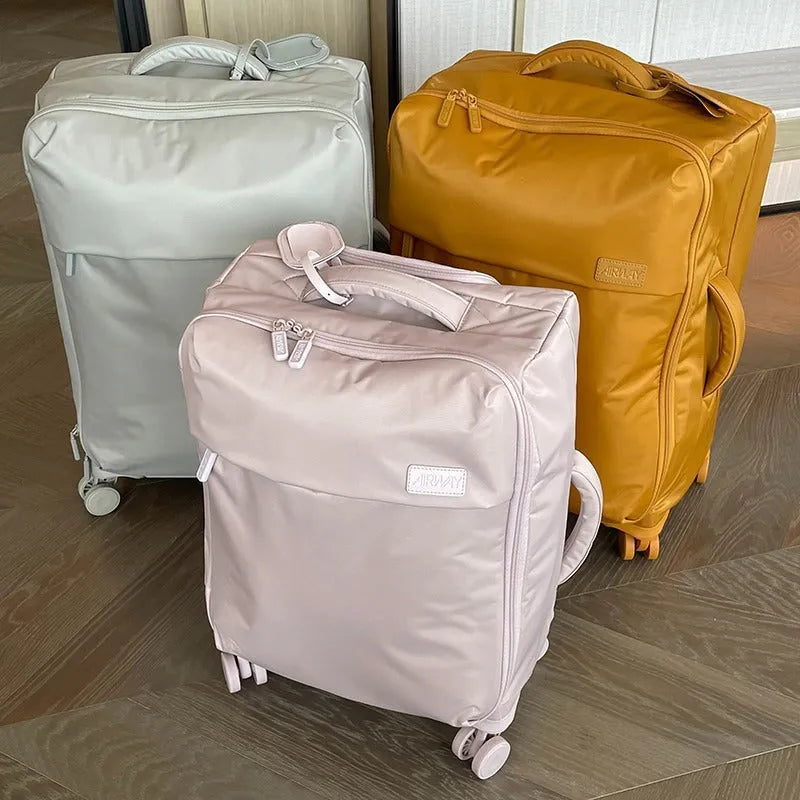 Ultra-light waterproof Oxford cloth suitcase with universal wheels in bluestone green colour.