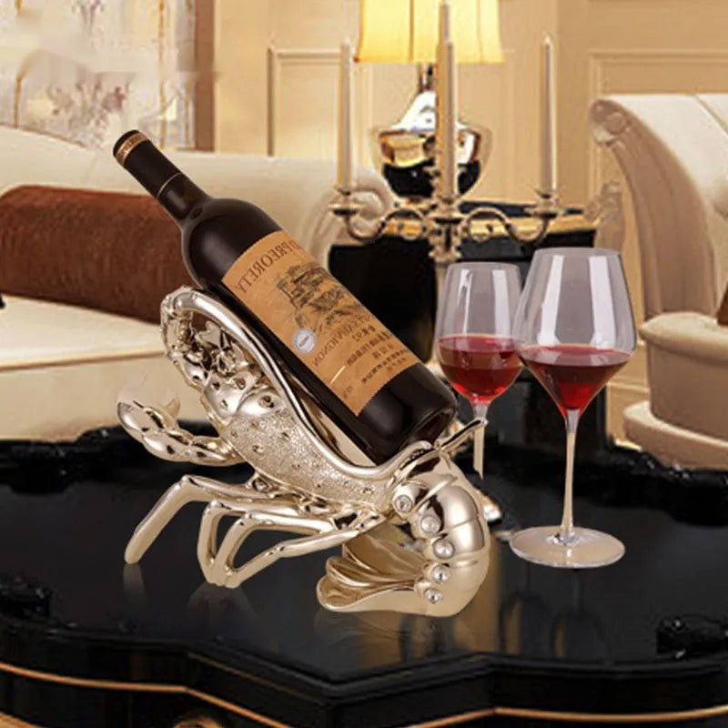Lobster-shaped wine rack ornament in rose gold or silver, holding a single bottle.