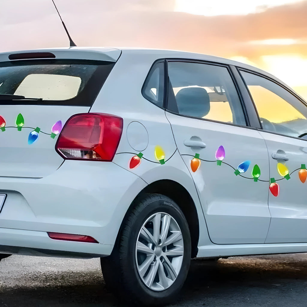 Set of magnetic reflective Christmas light bulb and wire stickers on a metal surface.