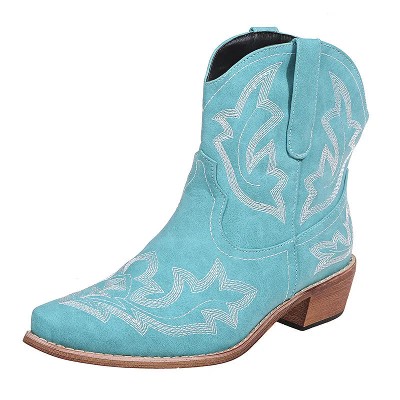 Blue women's cowboy ankle boots with embroidery, a pointed toe, and a low wedge heel.