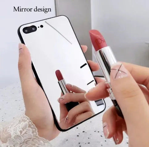 Black mirrored back cover phone case for Apple iPhone models on a table.