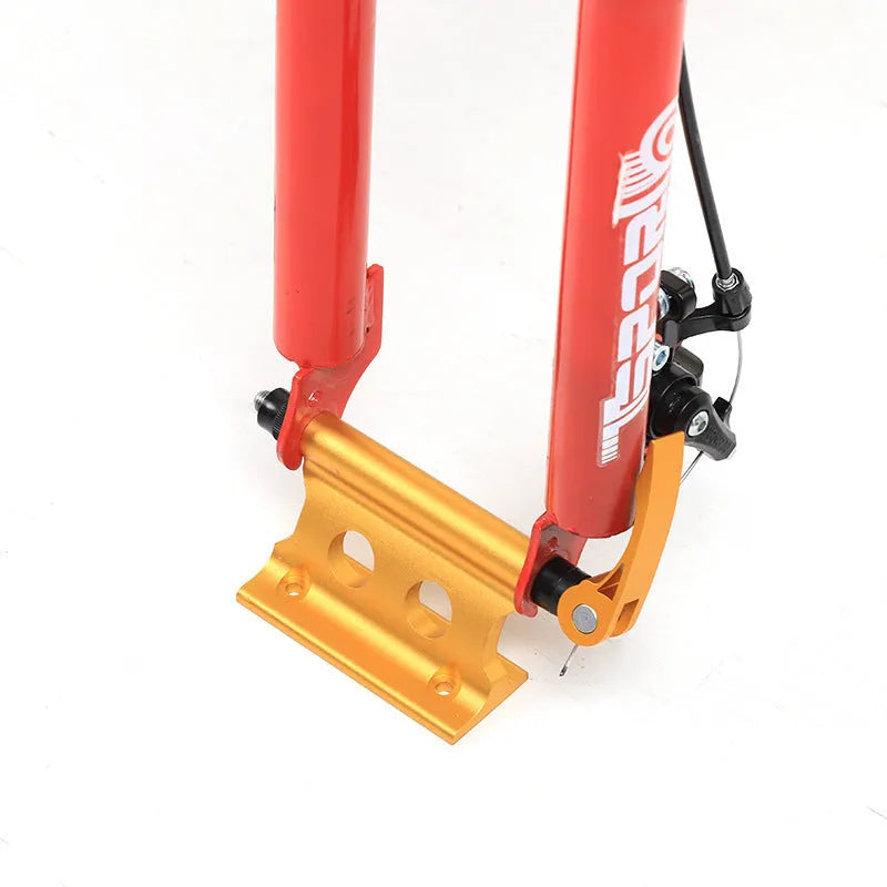 Silver metal quick release clamp for attaching a rack to a bicycle front fork.