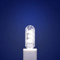 Small white USB-powered LED baby night light showing warm and cool light modes.