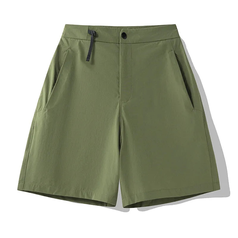 Men's khaki quick-drying sports shorts with 3D elastic cutting on a grey background.
