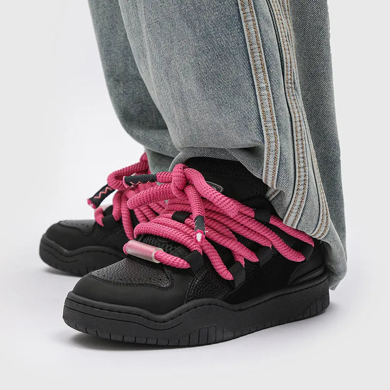 Low-top unisex casual shoes in denim blue with white rubber sole and lace-up front.