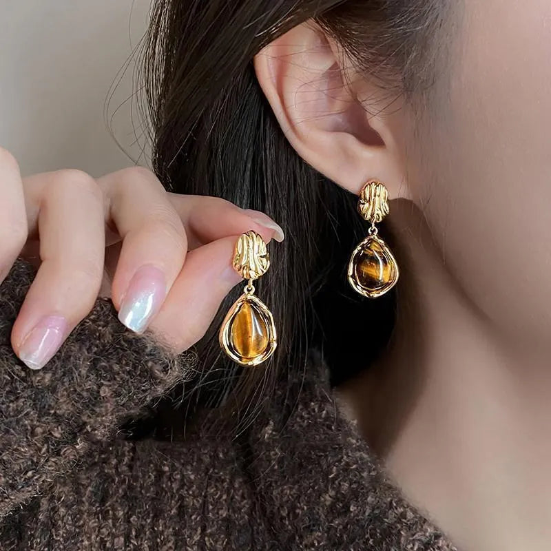 Handmade alloy holiday earrings set showing three geometric styles with tassel detailing