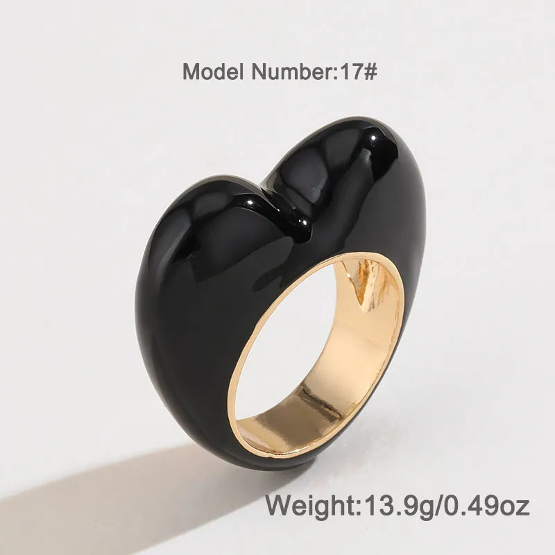 A heart-shaped three-dimensional enamel ring in zinc alloy, shown in one of four available colours.