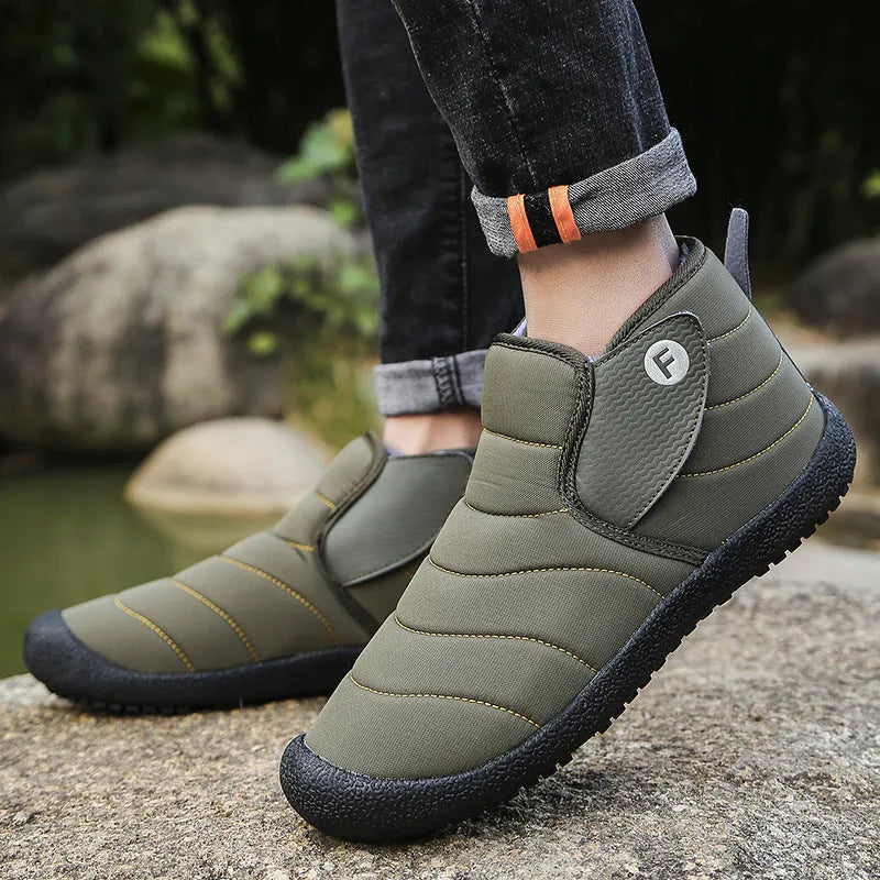 Men's thick cotton snow boots with a non-slip rubber sole in black, shown on a hard surface.