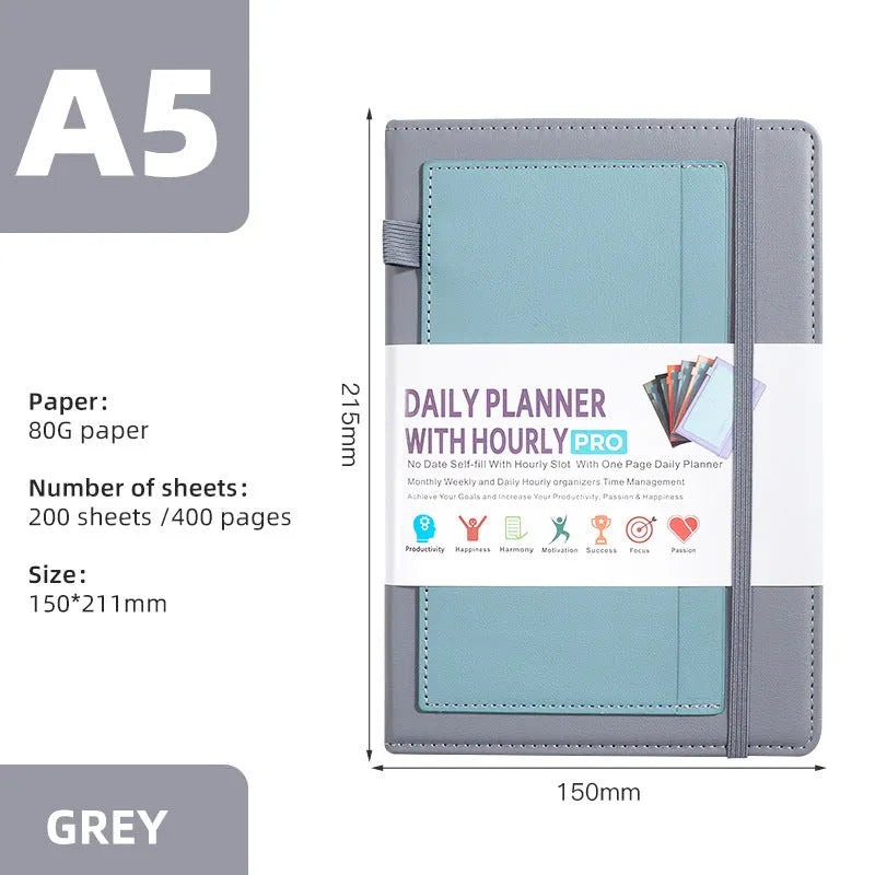 A5 notebook with purple PU cover closed by a black elastic strap