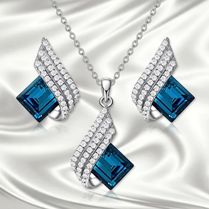Women's necklace and earring set with glass pendant on cross chain, electroplated finish