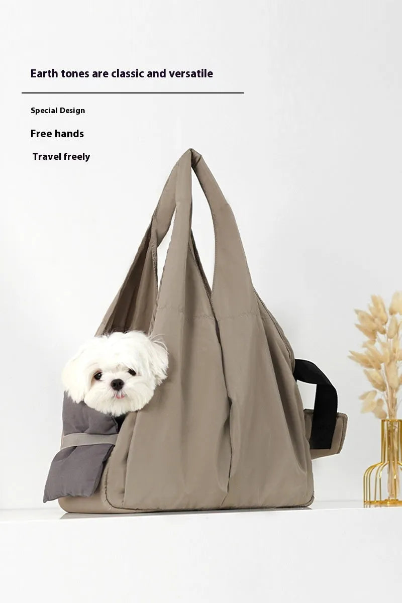 Apricot coloured cloth pet handbag carrier with dimensions 41 cm by 16 cm by 28 cm.