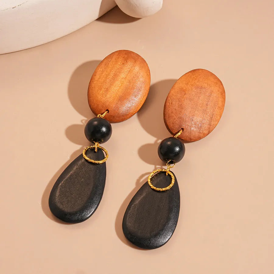 Wooden retro fashion earrings with elliptical shape and silver-brown-black colour combination