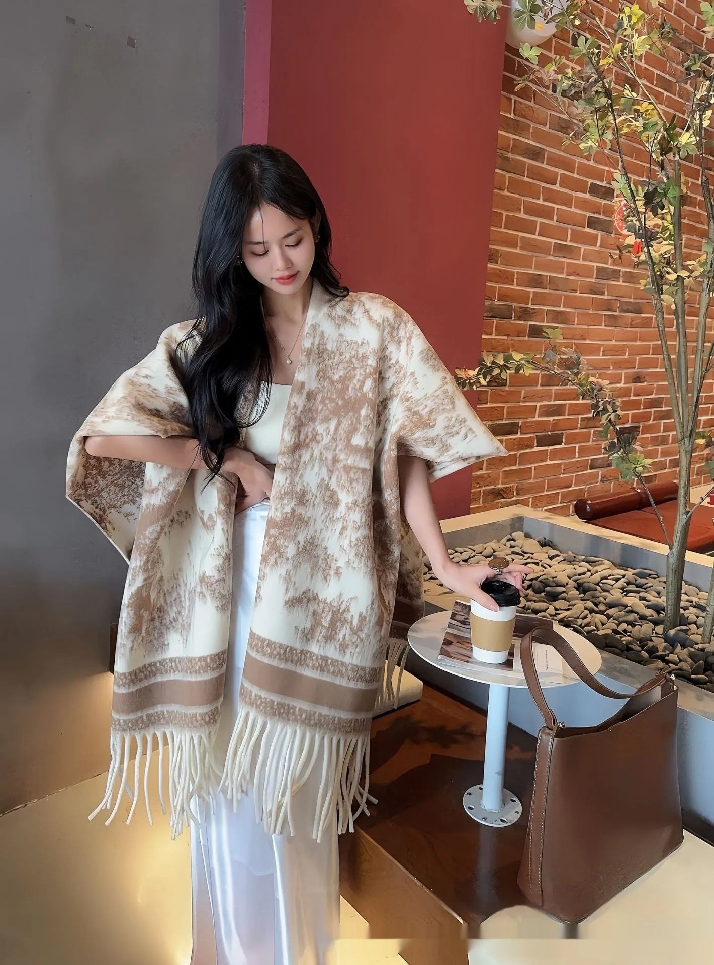 Women's polyester scarf cape with tassel edges in shawl style, shown in one of five available colours