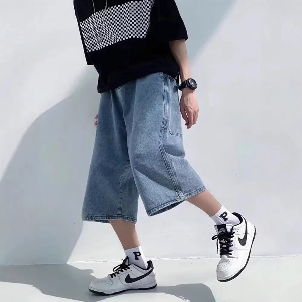 Men's blue washed denim cropped pirate shorts with a high waist and straight legs.