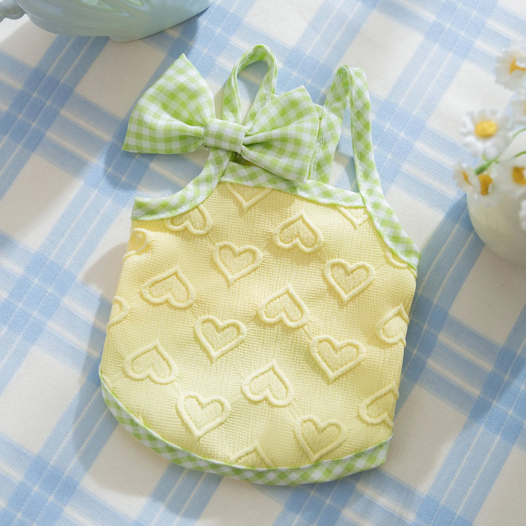 Small dog wearing heart relief texture bow suspenders vest in Bondi Blue colour
