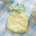 Small dog wearing heart relief texture bow suspenders vest in Bondi Blue colour