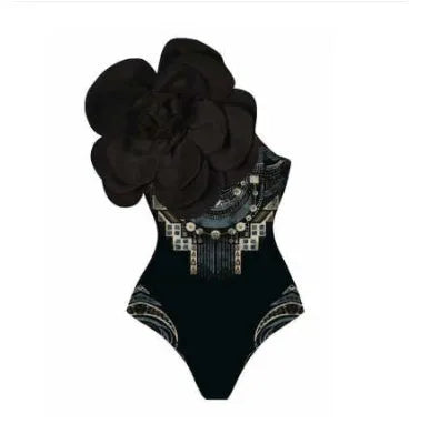 Close-up of a solid colour one-piece swimsuit with raised three-dimensional flower pattern detail