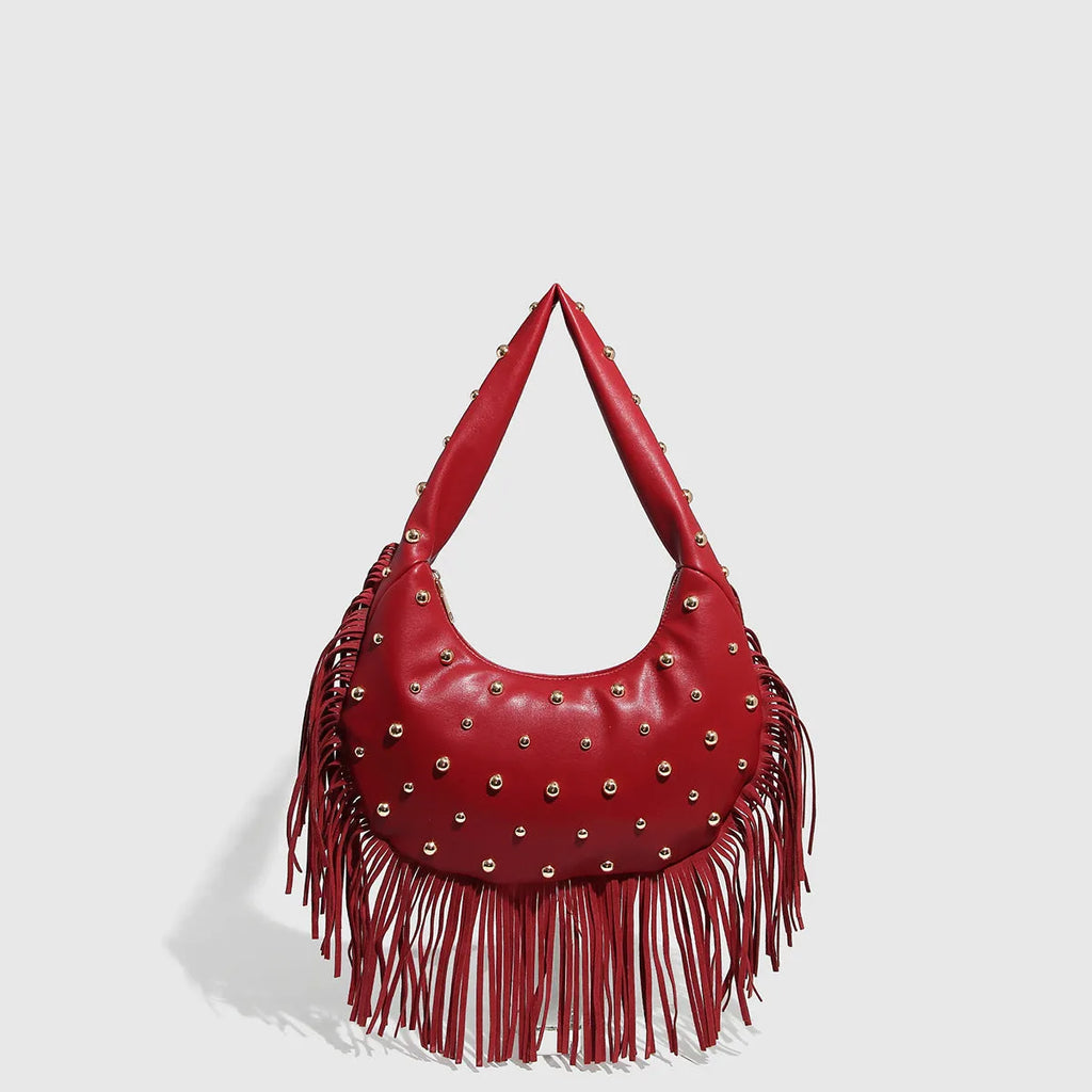 Retro black shoulder handbag with a long tassel decoration and an internal phone pocket.