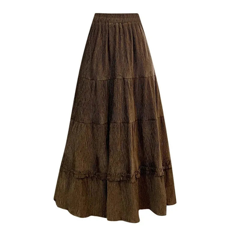 Corduroy A-line midi skirt with elastic waistband in beige, black or brown colours showing Korean style slimming silhouette