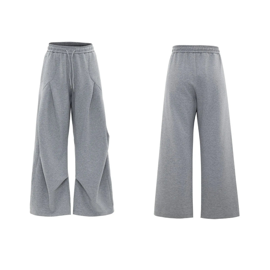 Men's dark grey V-neck sports jacket with padded shoulders and matching shorts
