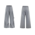 Men's dark grey V-neck sports jacket with padded shoulders and matching shorts