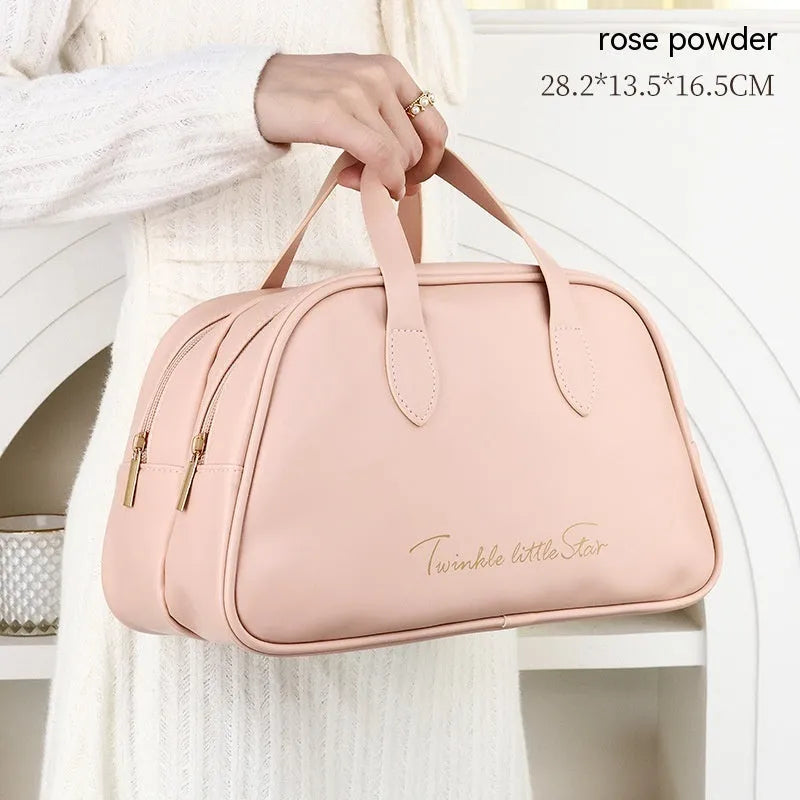 Leather travel toiletry bag in caramel mocha colour showing storage compartments and decorative letter details