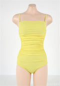 Sling style one-piece swimsuit with belly pleating in a solid colour.