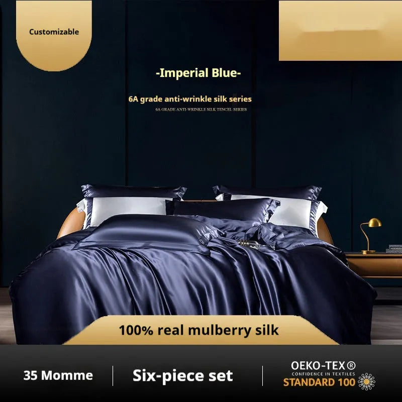 Silk four-piece quilt cover set in a solid colour, shown in a bedroom setting on a bed.