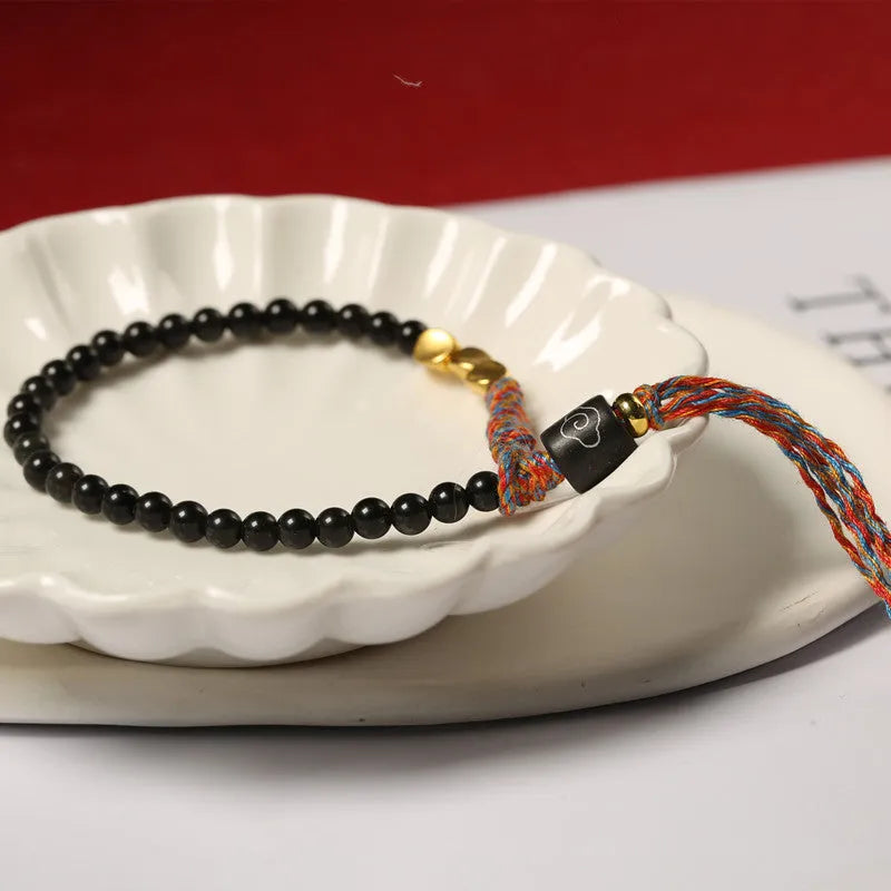 Hand-woven obsidian bracelet strap showing textured detail and 4mm width