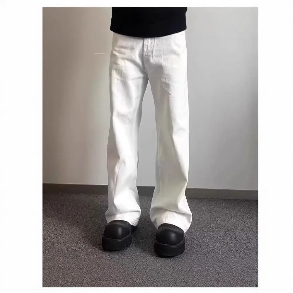 Men's white straight leg wide fit cotton denim jeans on a hanger