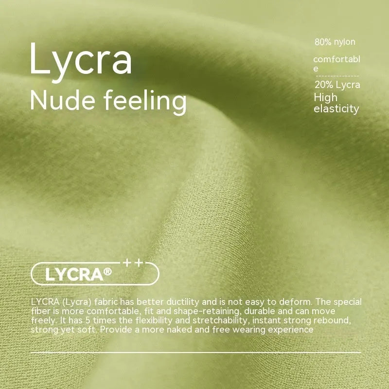 Women's high waist Lycra yoga shorts in leaf green, shown in a yoga pose.