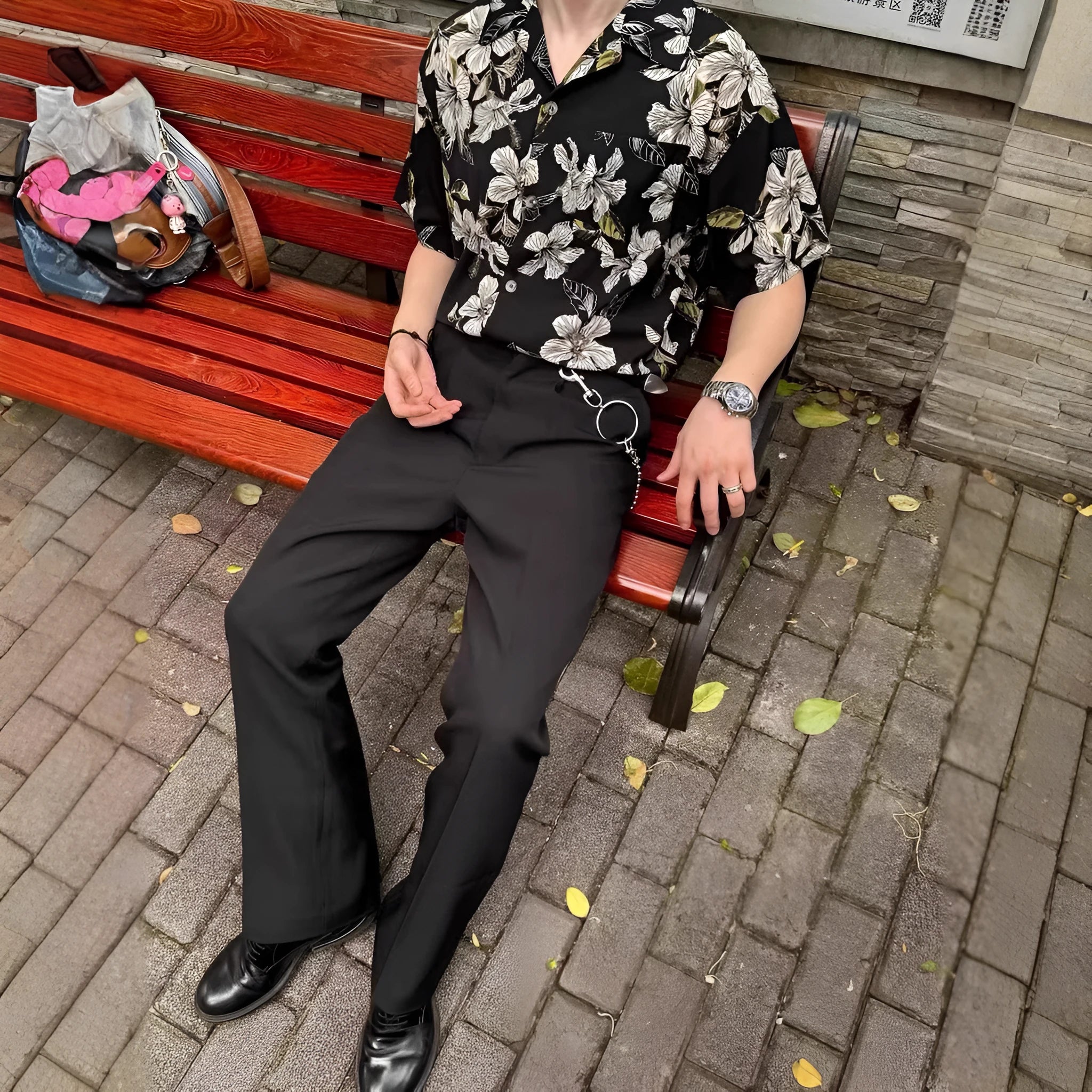 Black floral print vintage Cuban collar ice silk shirt with short sleeves on hanger