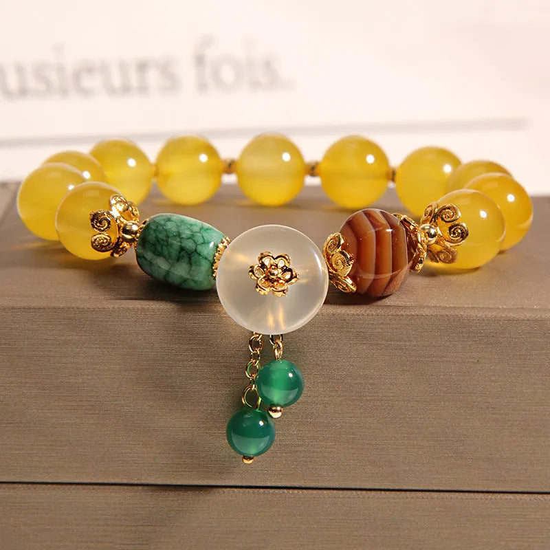 Khaki yellow agate and crystal women's bracelet on gold silk string.
