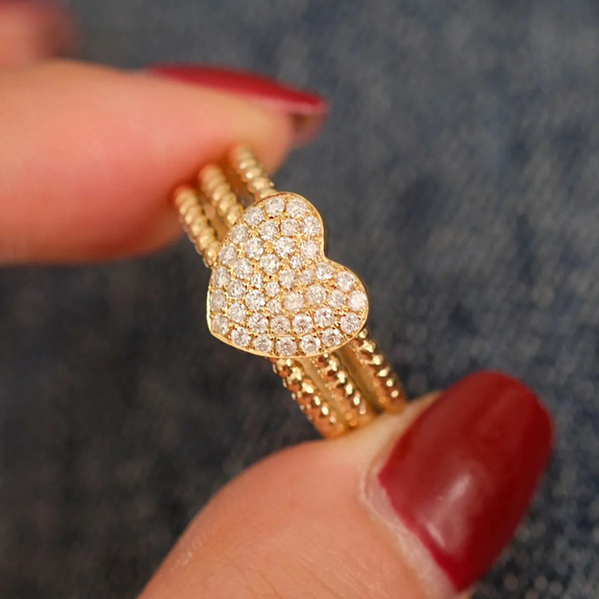 S925 sterling silver ring with heart twist design, available in white gold or yellow gold finish, US sizes 6 to 10