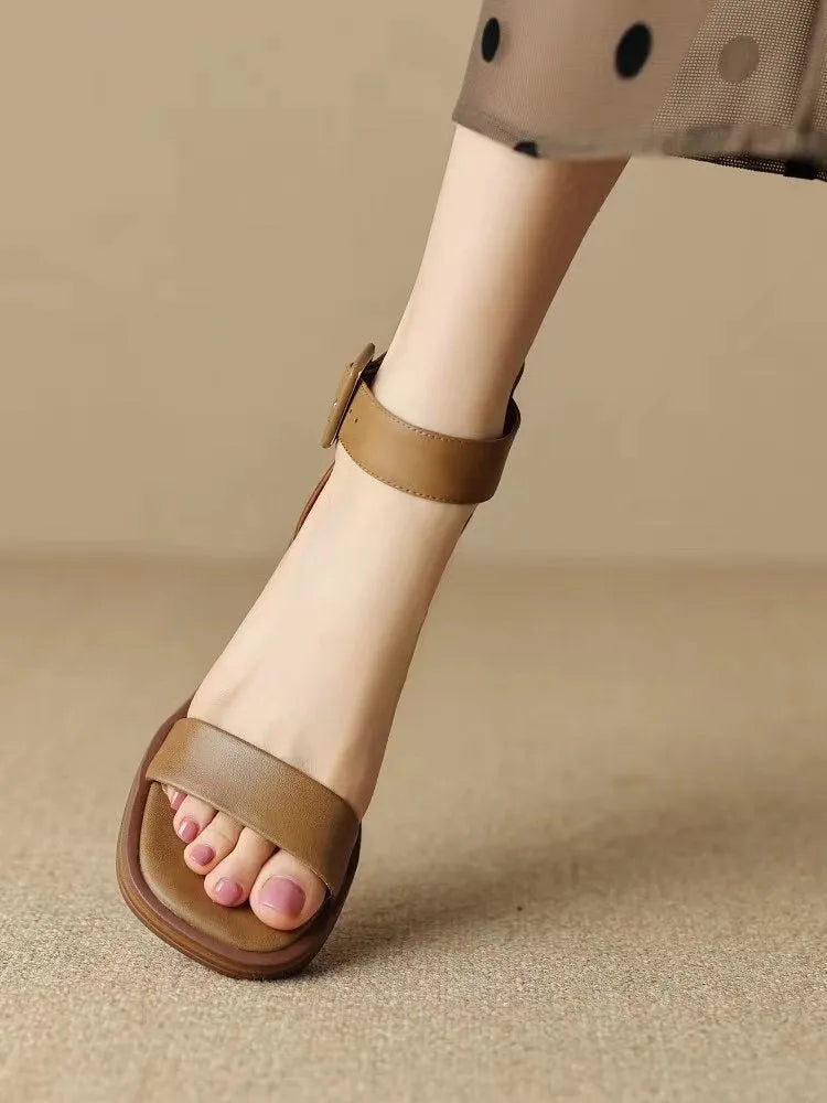 White women's retro platform high heels with an ankle strap and round toe.