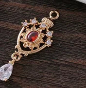 Small hollow water drop-shaped pendant with crown design and micro zircon details in various colours.