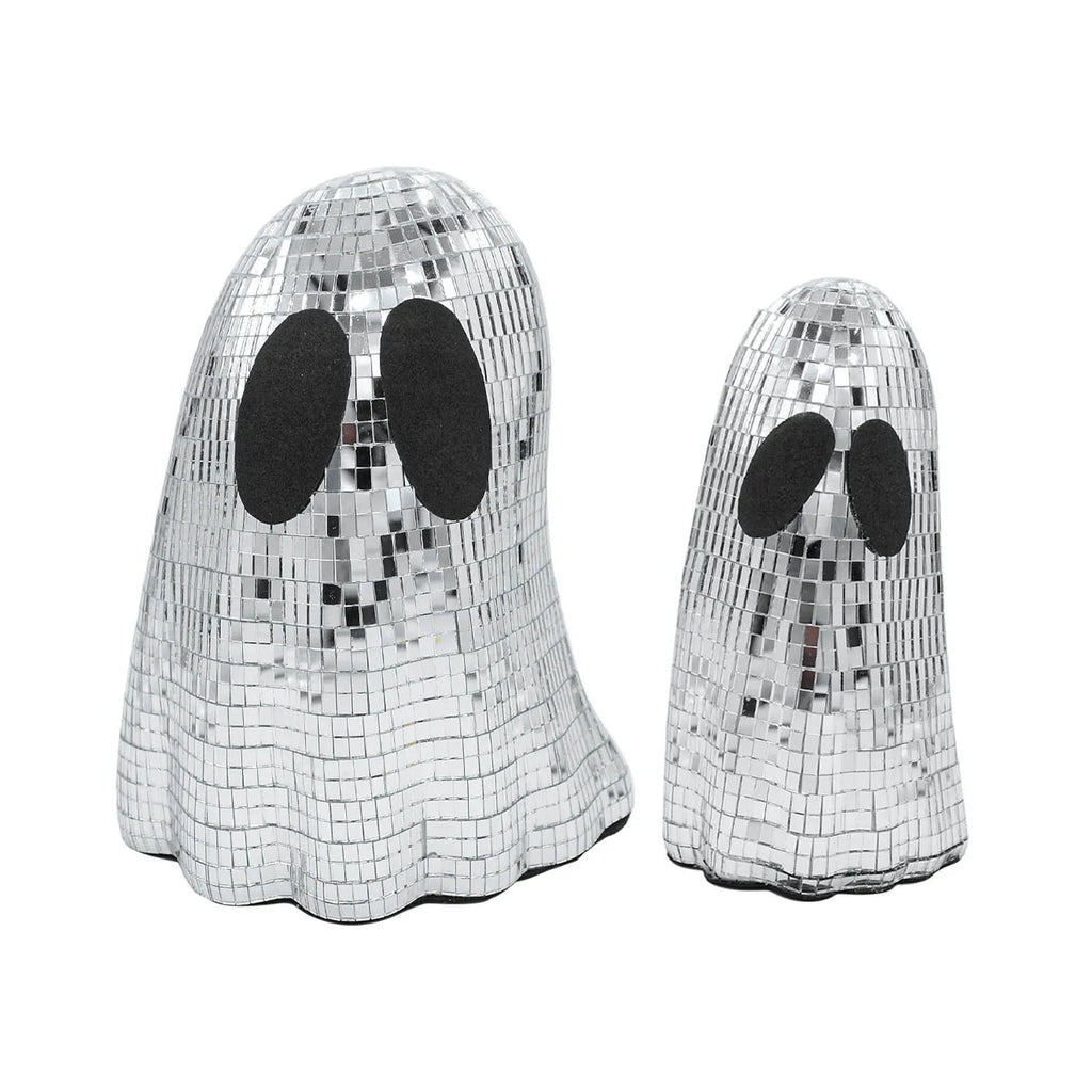 Silver Halloween ghost ornament with mosaic glass surface on wooden desk