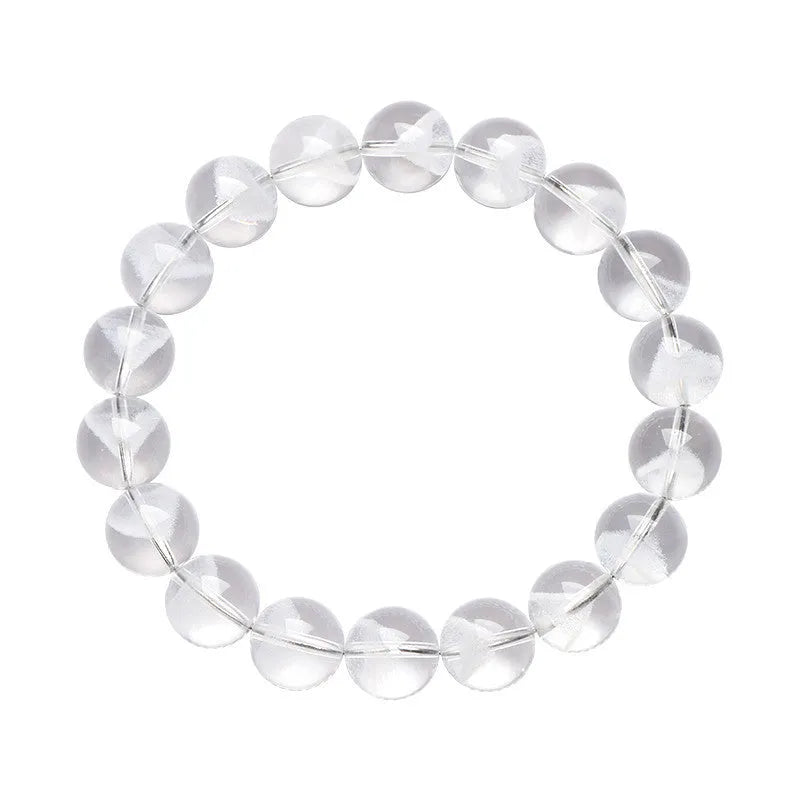 Women's white crystal ghost pyramid bracelet with Ruyi symbol on wrist, showing bead detail.