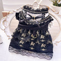 Golden gothic lolita-style skirt costume on a small dog, showing princess design.