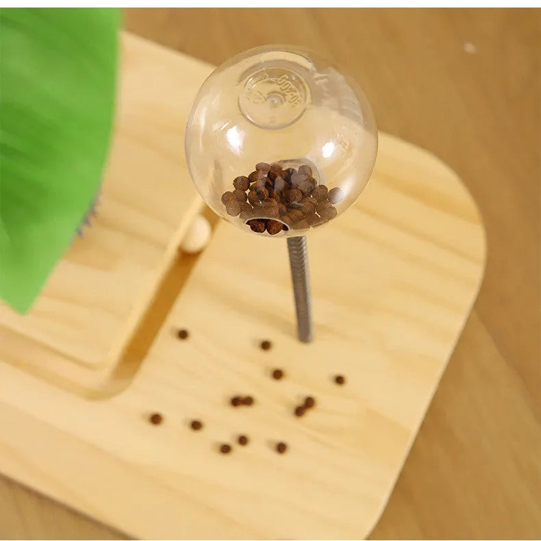 A vertical wooden cat scratching post in a canna colour with an attached food drop ball.