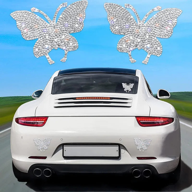 Close-up of a diamond-encrusted butterfly and bear claw design on a 7x6cm glass car sticker
