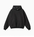 Man wearing a loose-fit cotton terry hooded sweater with drop-shoulder sleeves in a solid colour.