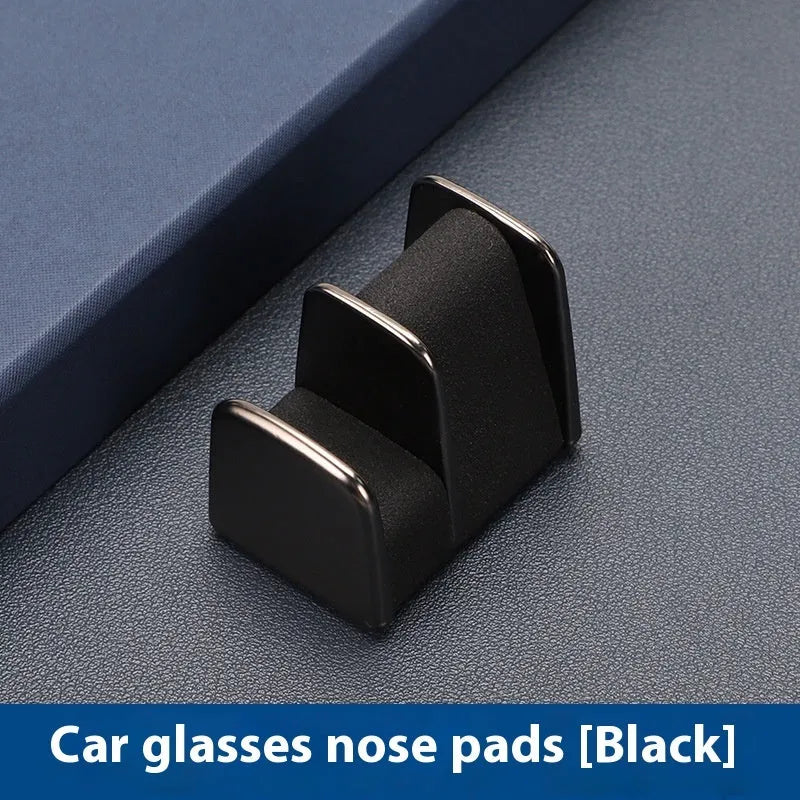 Zinc alloy and leather sunglasses clip for car dashboard storage in four colour options.